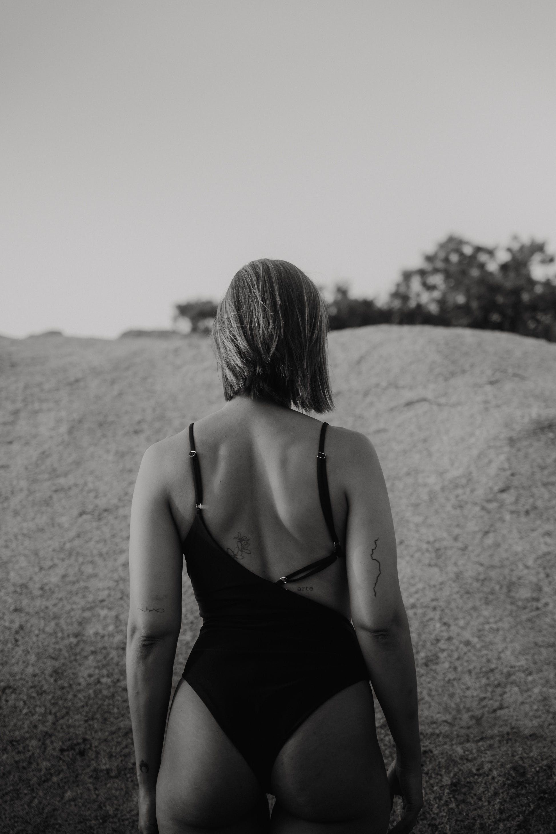 Back view showing adjustable straps of the Kauai cut-out Black One-piece