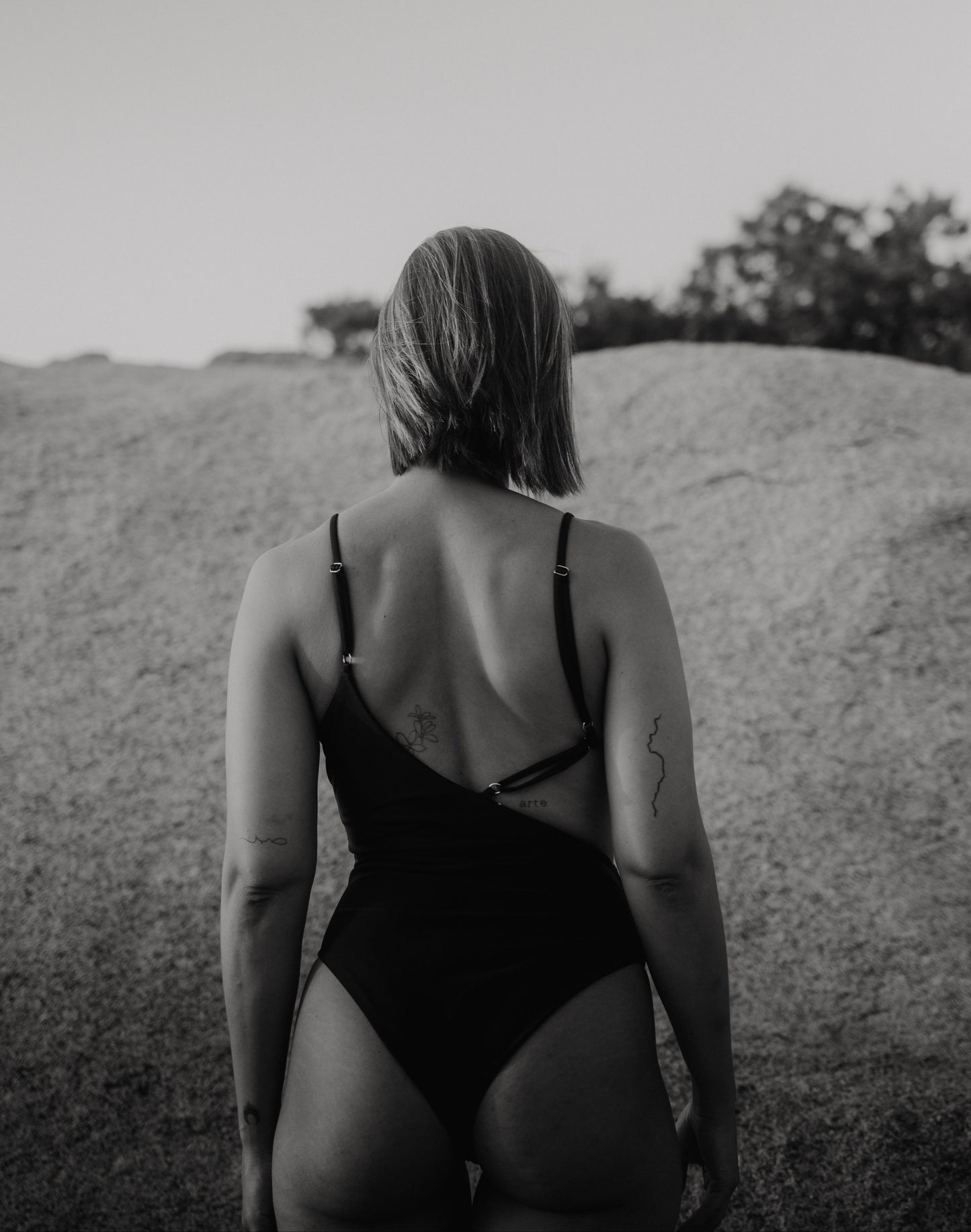 Back view showing adjustable straps of the Kauai cut-out Black One-piece
