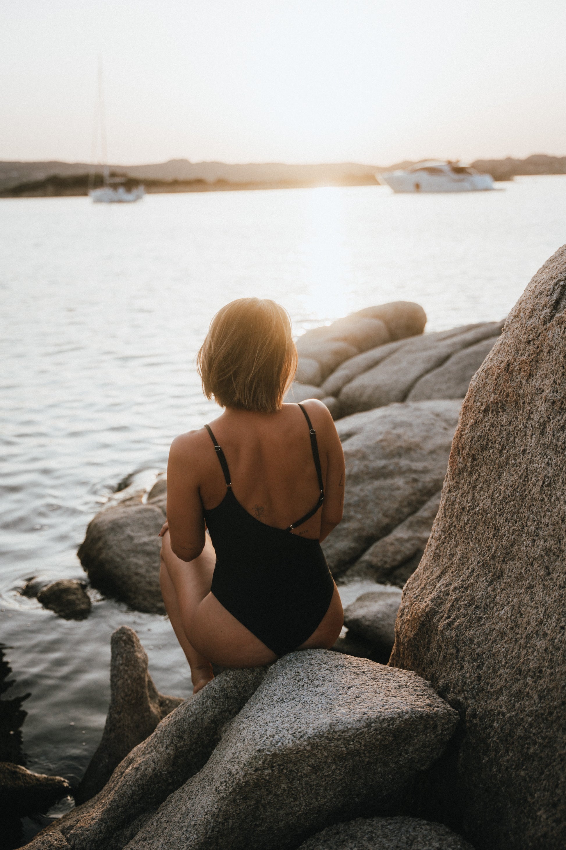 Back view showing adjustable straps of the Kauai cut-out Black One-piece